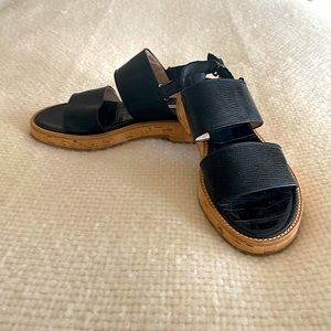 Dries Van Noten black faux lizard strap sandals & cork heels. Adjustable strap.
